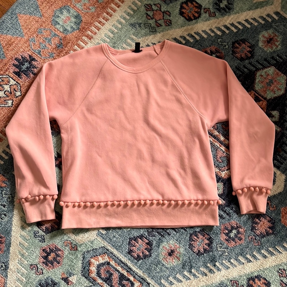 Pink J. Crew pompom hem and cuff crew neck